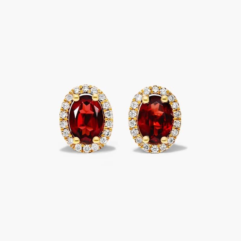 Oval Cut Garnet And Diamond Halo Stud Earrings In 14K Yellow Gold