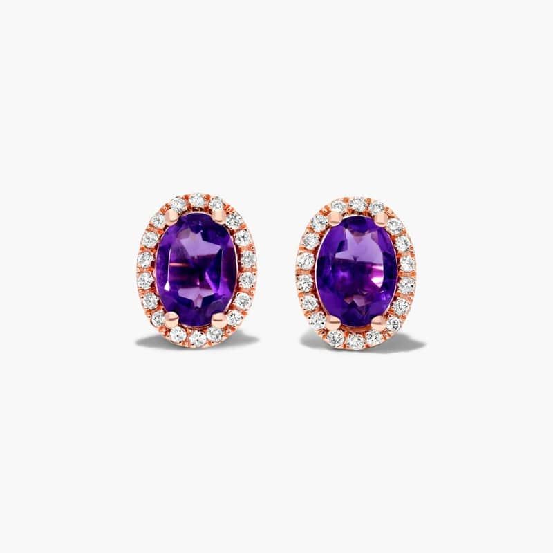 Oval Cut Amethyst And Diamond Halo Stud Earrings In 14K Rose Gold