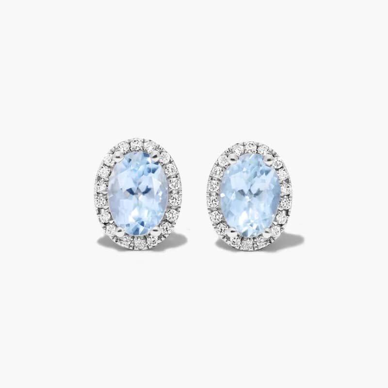 Oval Cut Aquamarine And Diamond Halo Stud Earrings In 14K White Gold