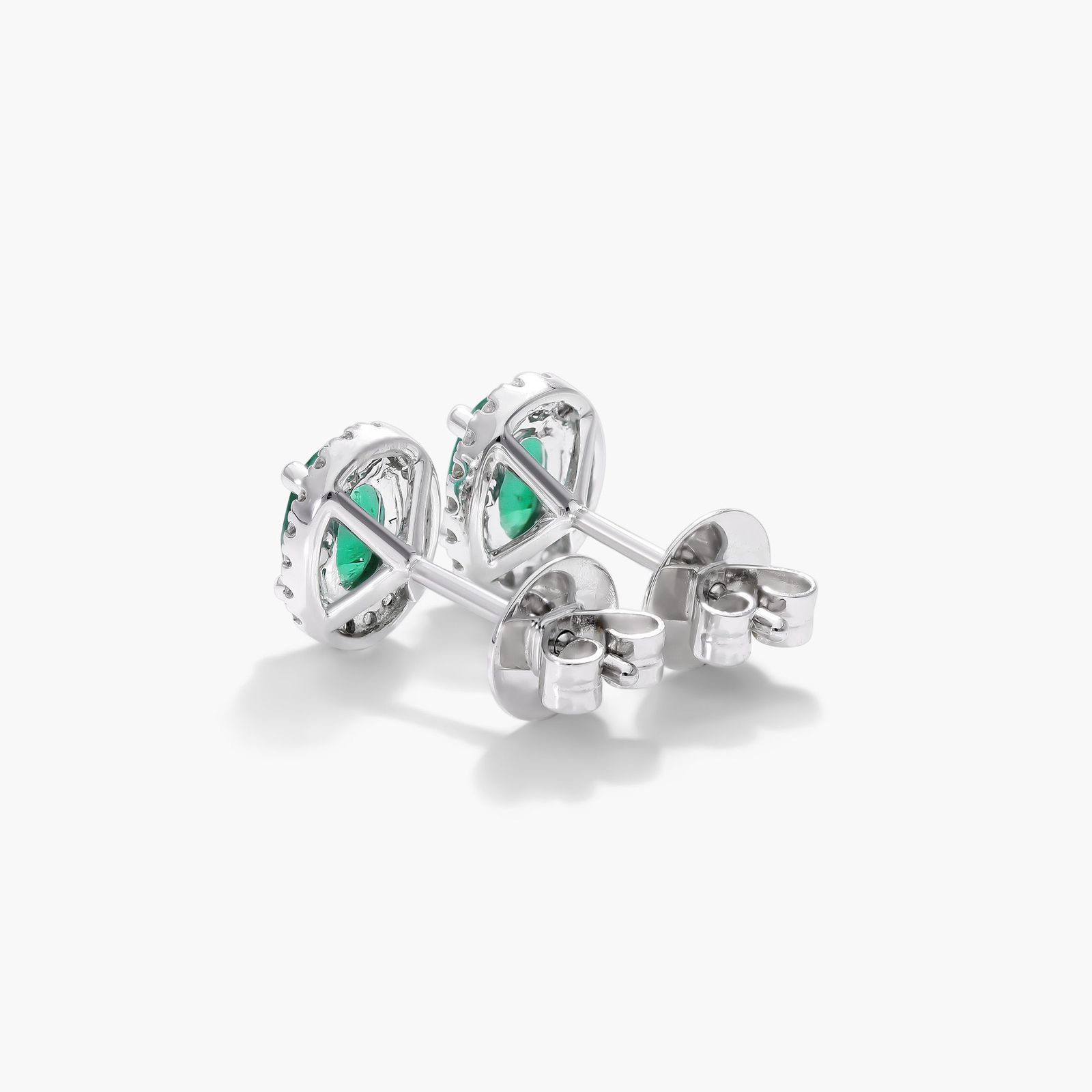 Oval Cut Emerald And Diamond Halo Earrings In 18K White Gold
