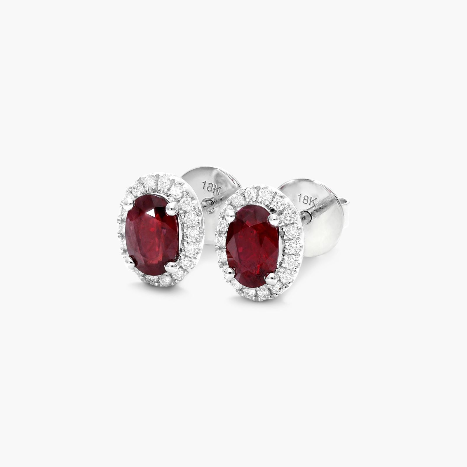 Oval Cut Ruby And Diamond Halo Earrings In 18K White Gold