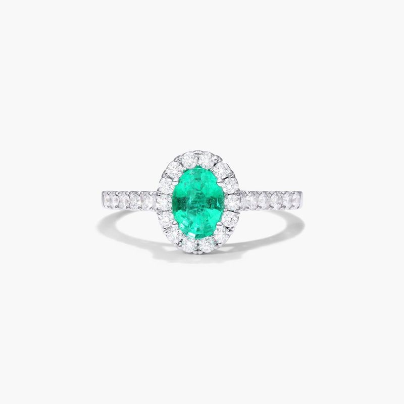 Oval Halo Emerald And Diamond Ring In 18K White Gold