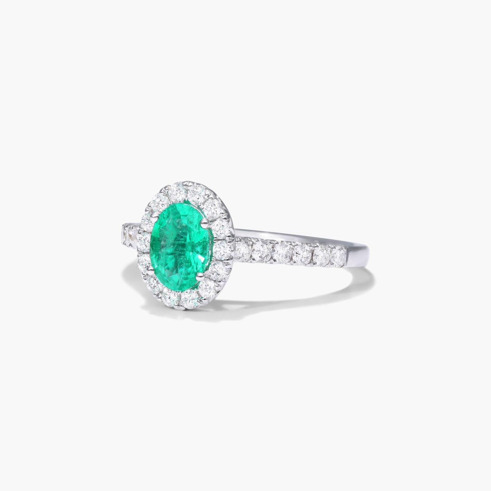 Oval Halo Emerald And Diamond Ring In 18K White Gold
