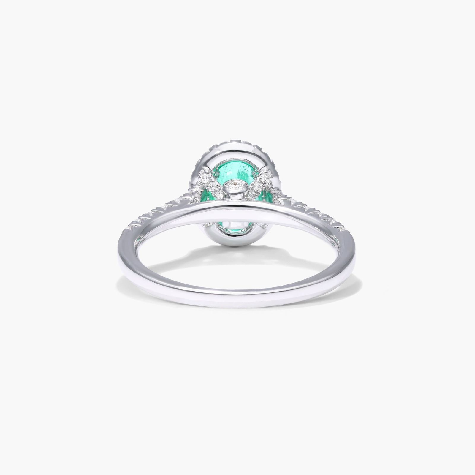 Oval Halo Emerald And Diamond Ring In 18K White Gold