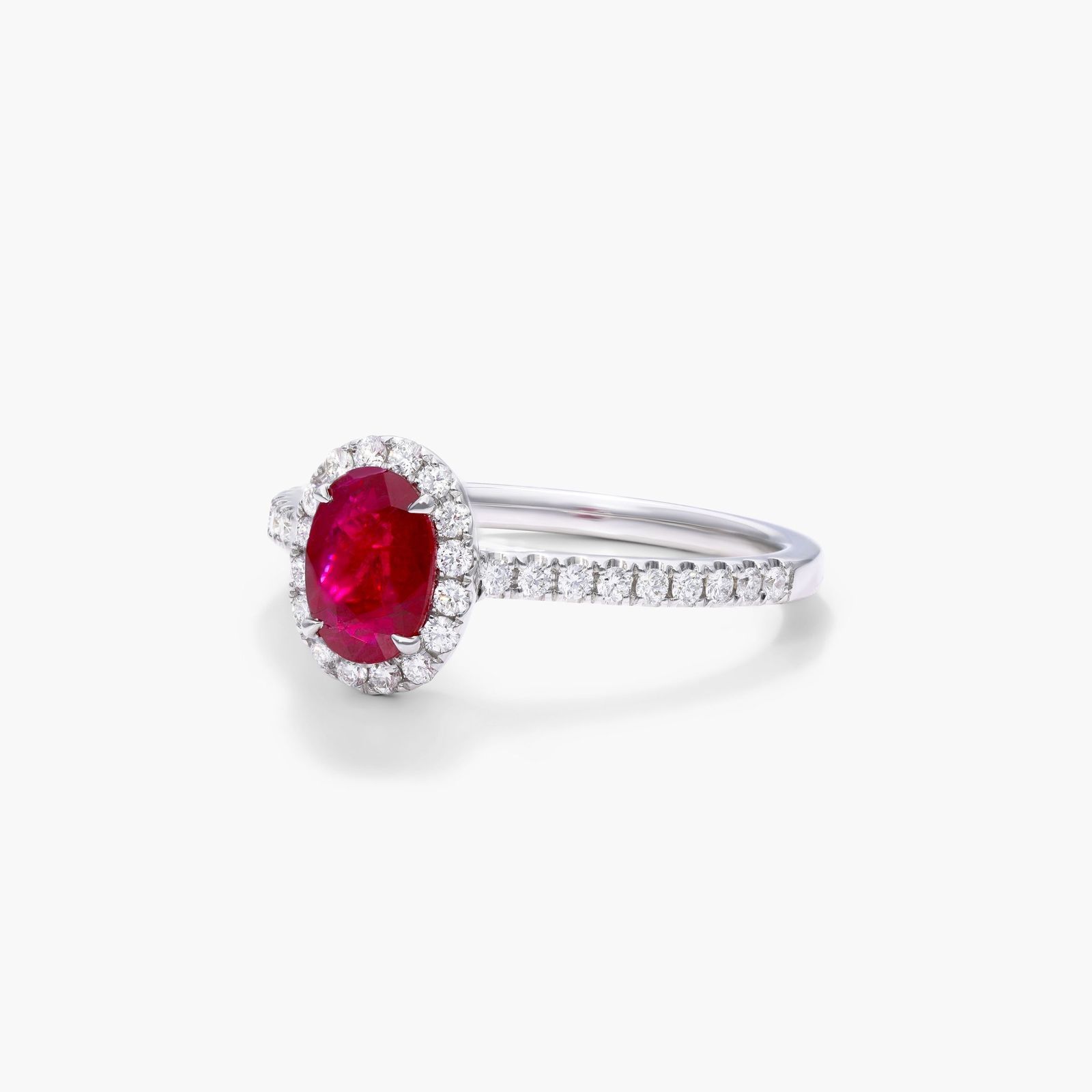 Oval Halo Ruby And Diamond Ring In 18K White Gold