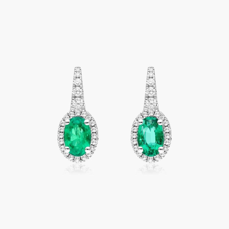 Petite Oval Cut Emerald And Diamond Halo Drop Earrings In 18K White Gold