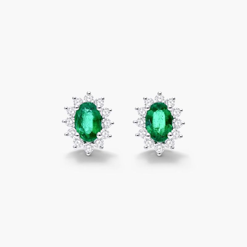 Oval Cut Emerald And Diamond Halo Earrings In 18K White Gold
