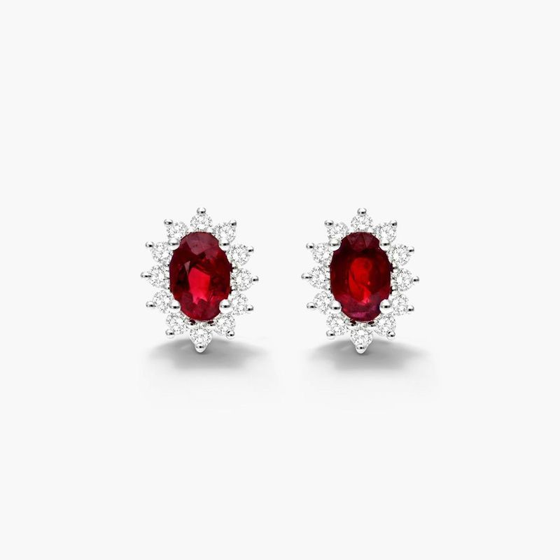 Oval Cut Ruby And Diamond Halo Earrings In 18K White Gold