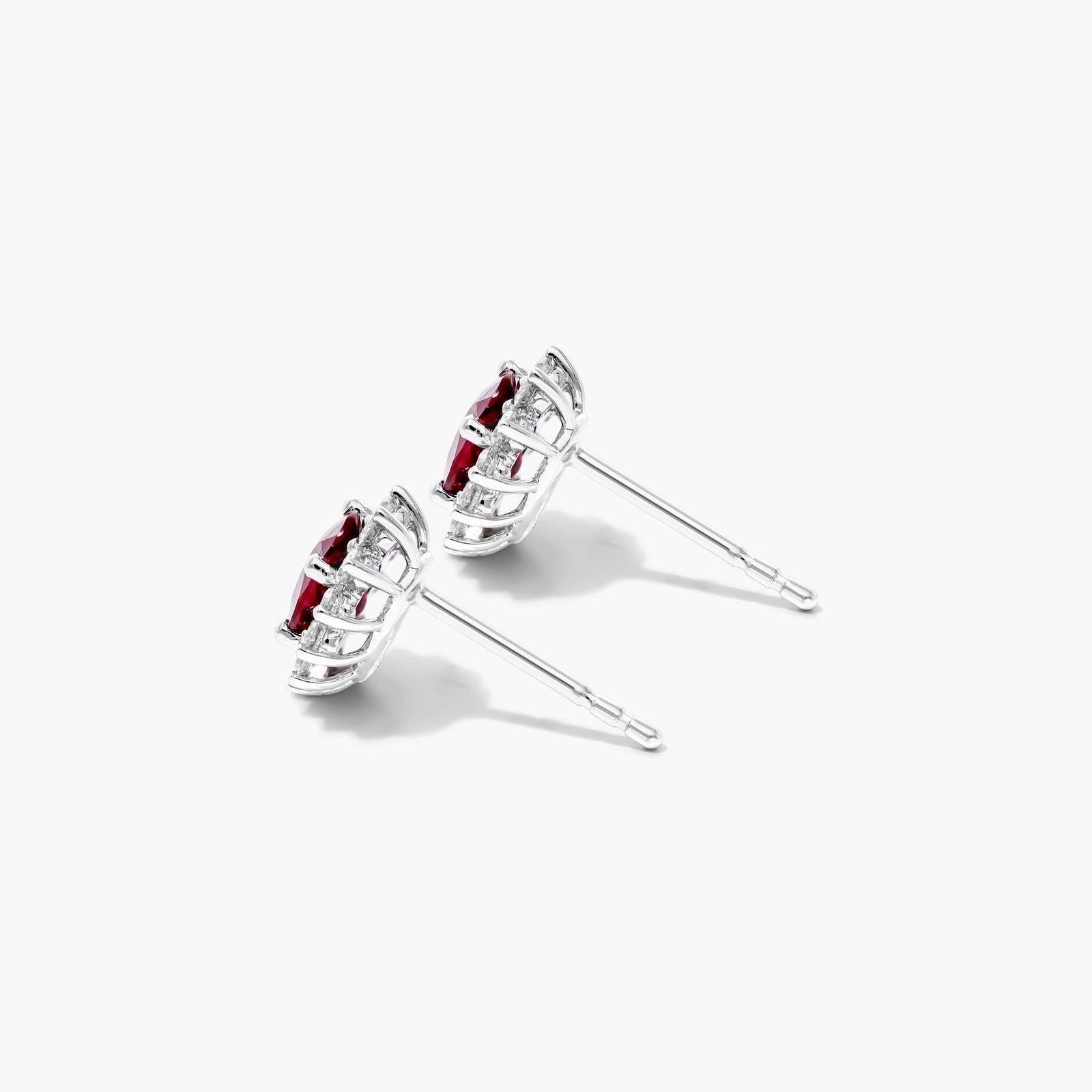 Oval Cut Ruby And Diamond Halo Earrings In 18K White Gold