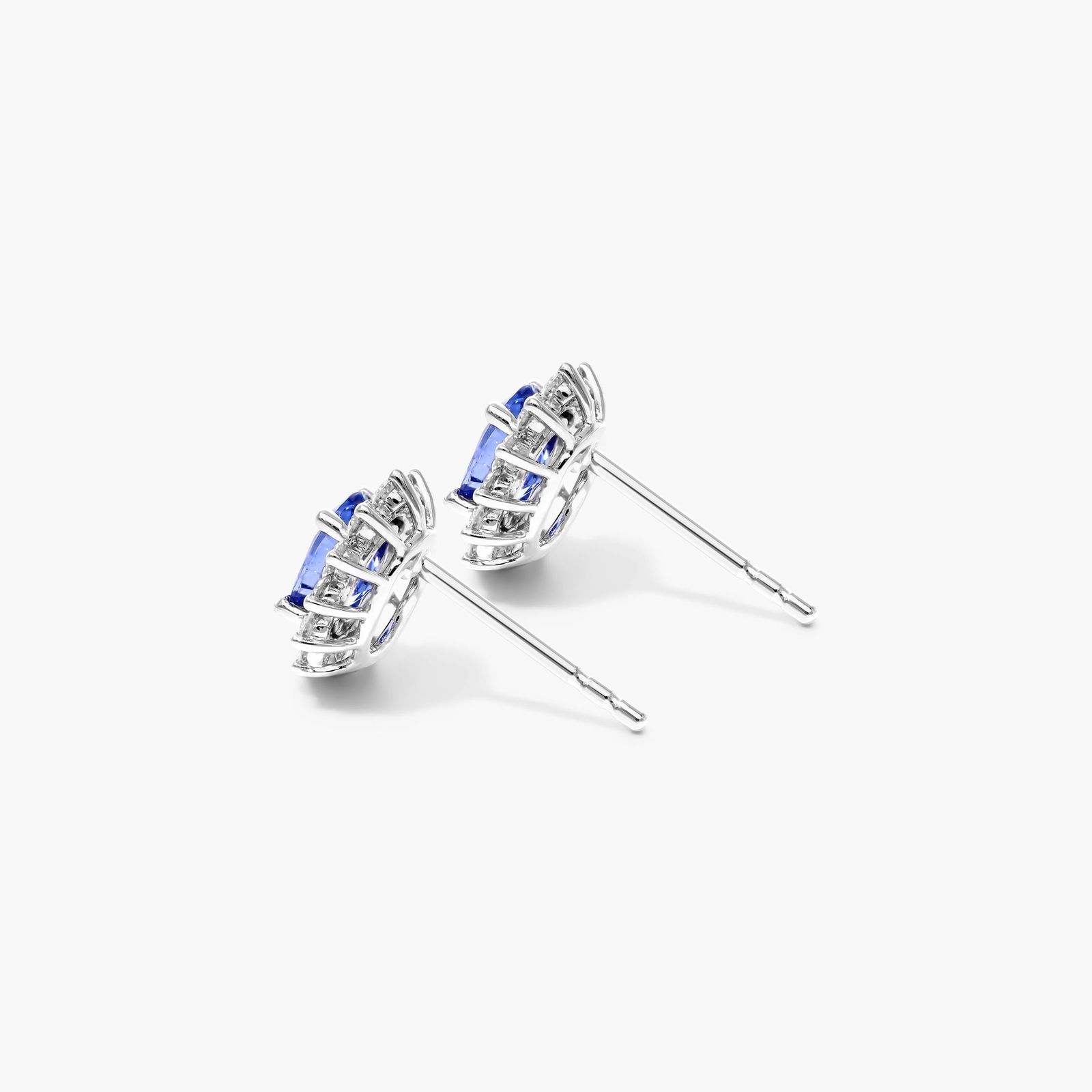 Oval Cut Sapphire And Diamond Halo Earrings In 18K White Gold