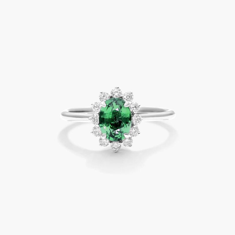 Oval Halo Emerald And Diamond Ring In 18K White Gold