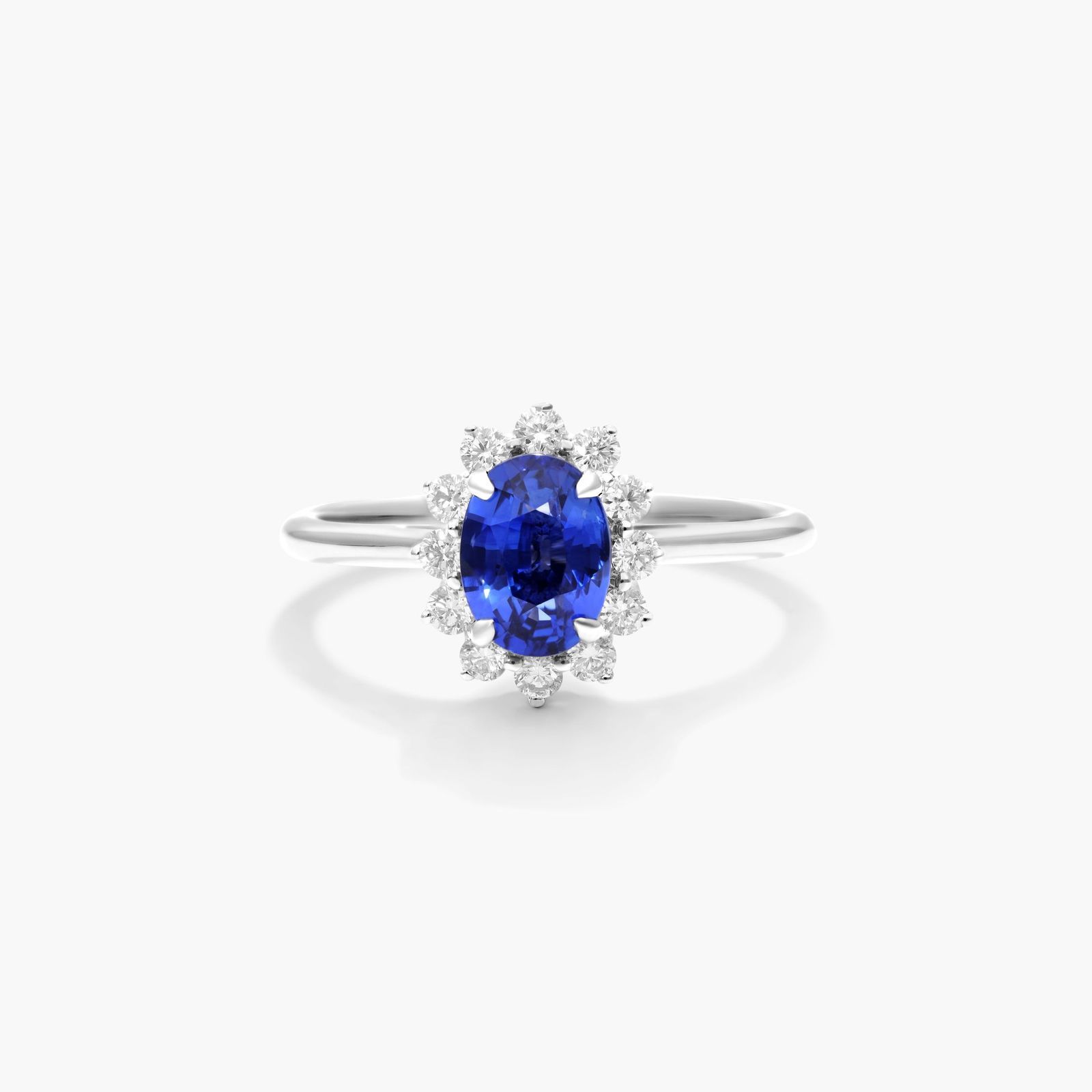 Oval Halo Sapphire And Diamond Ring In 18K White Gold
