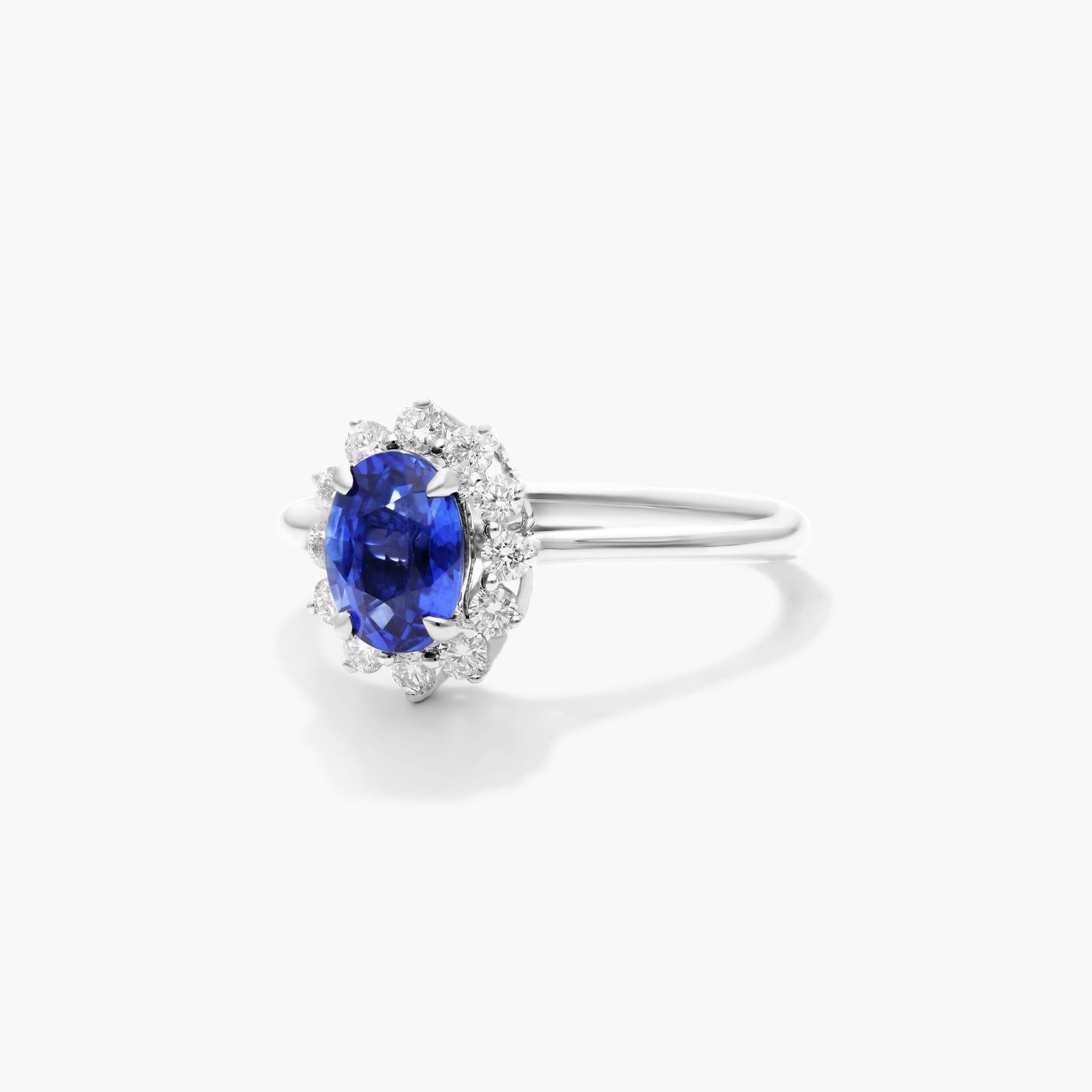 Oval Halo Sapphire And Diamond Ring In 18K White Gold