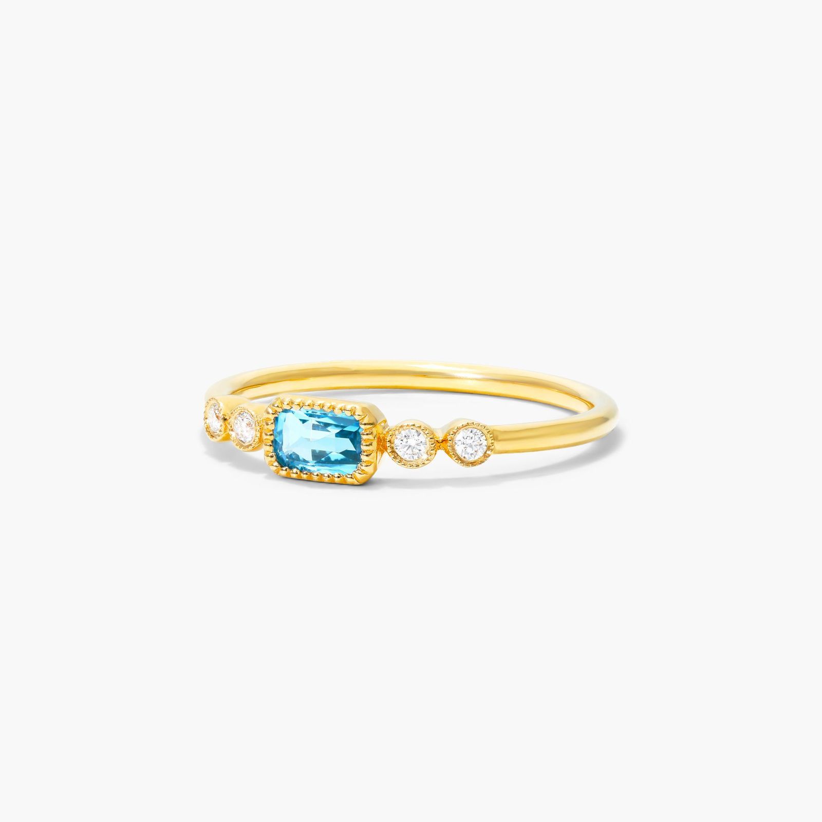 Dainty Blue Topaz Bezel Diamond Ring In 14K Yellow Gold by Brevani