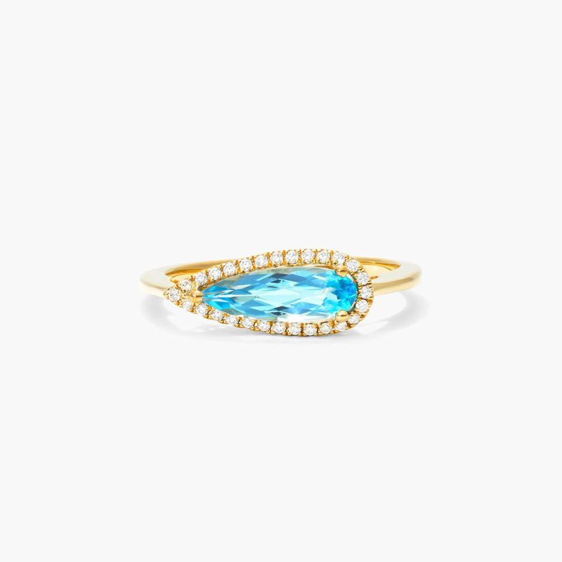 Teardrop Blue Topaz And Diamond Halo Ring In 14K Yellow Gold by Brevani