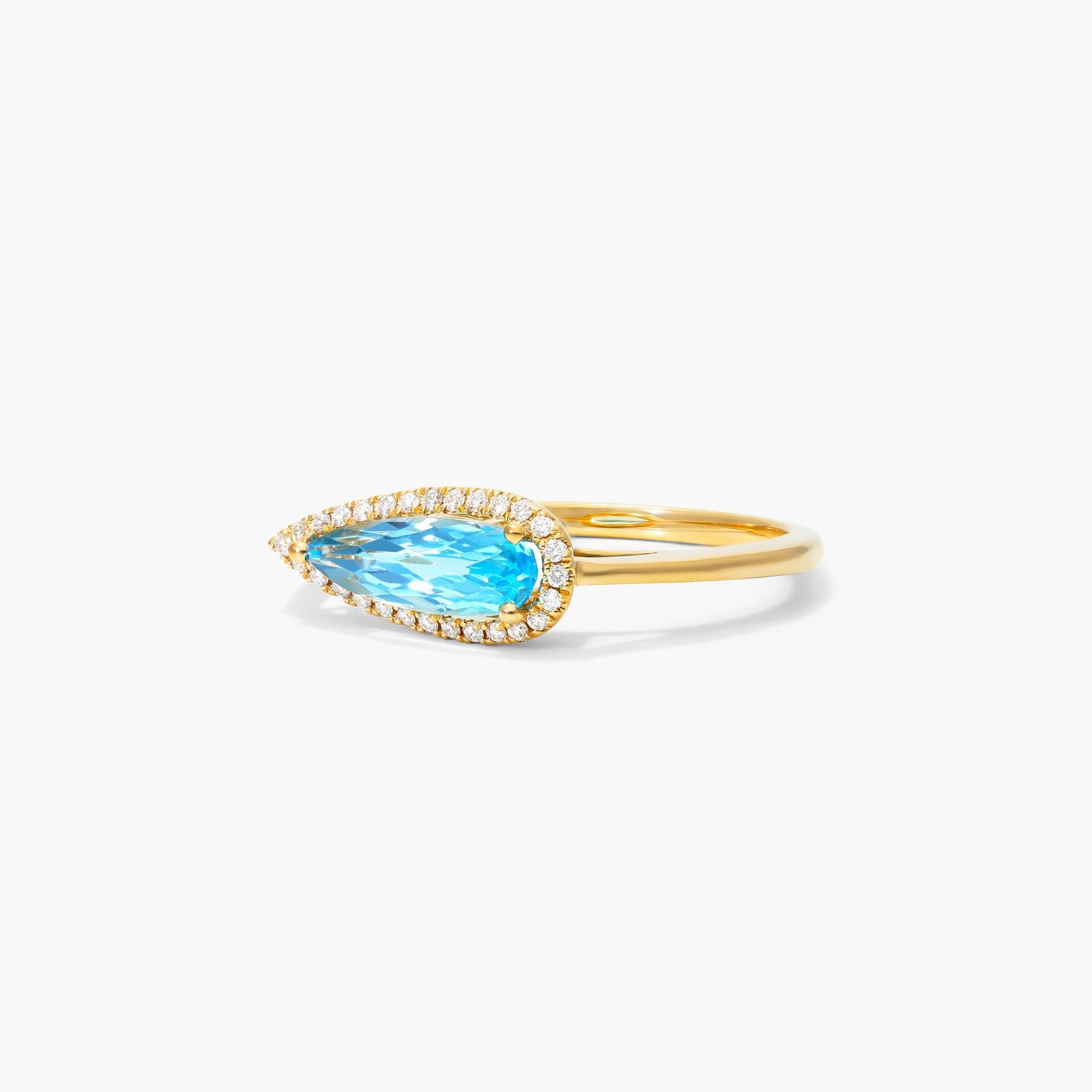 Teardrop Blue Topaz And Diamond Halo Ring In 14K Yellow Gold by Brevani