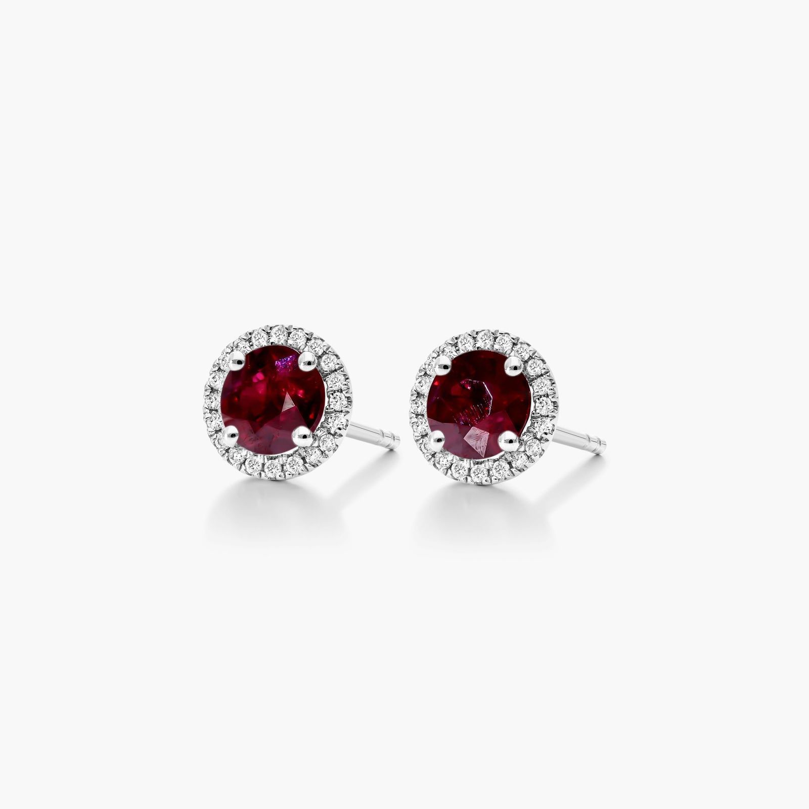 Round Ruby And Diamond Halo Earrings In 18K White Gold
