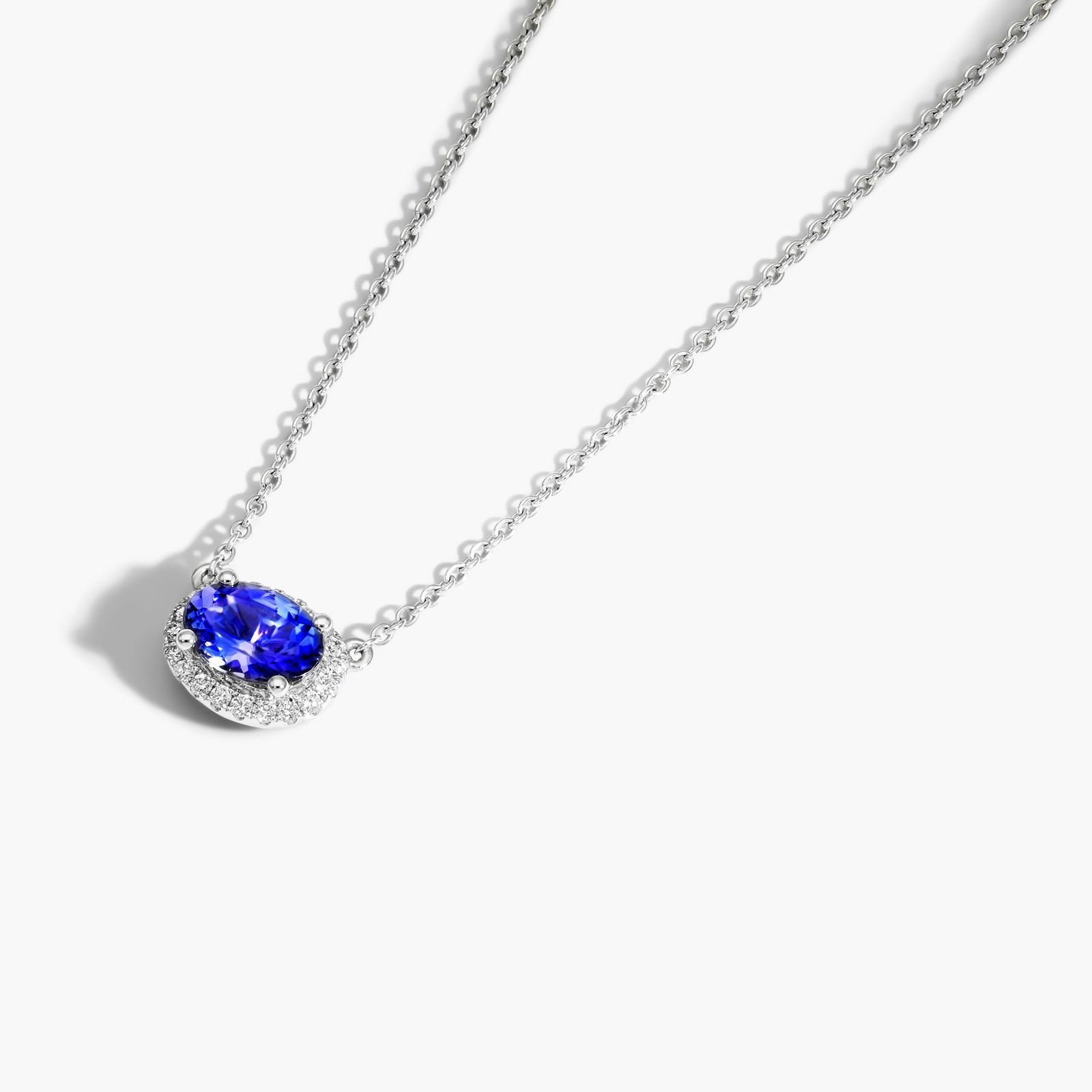 14K White Gold East West Set Oval Halo Tanzanite and Diamond Necklace (7x5mm)