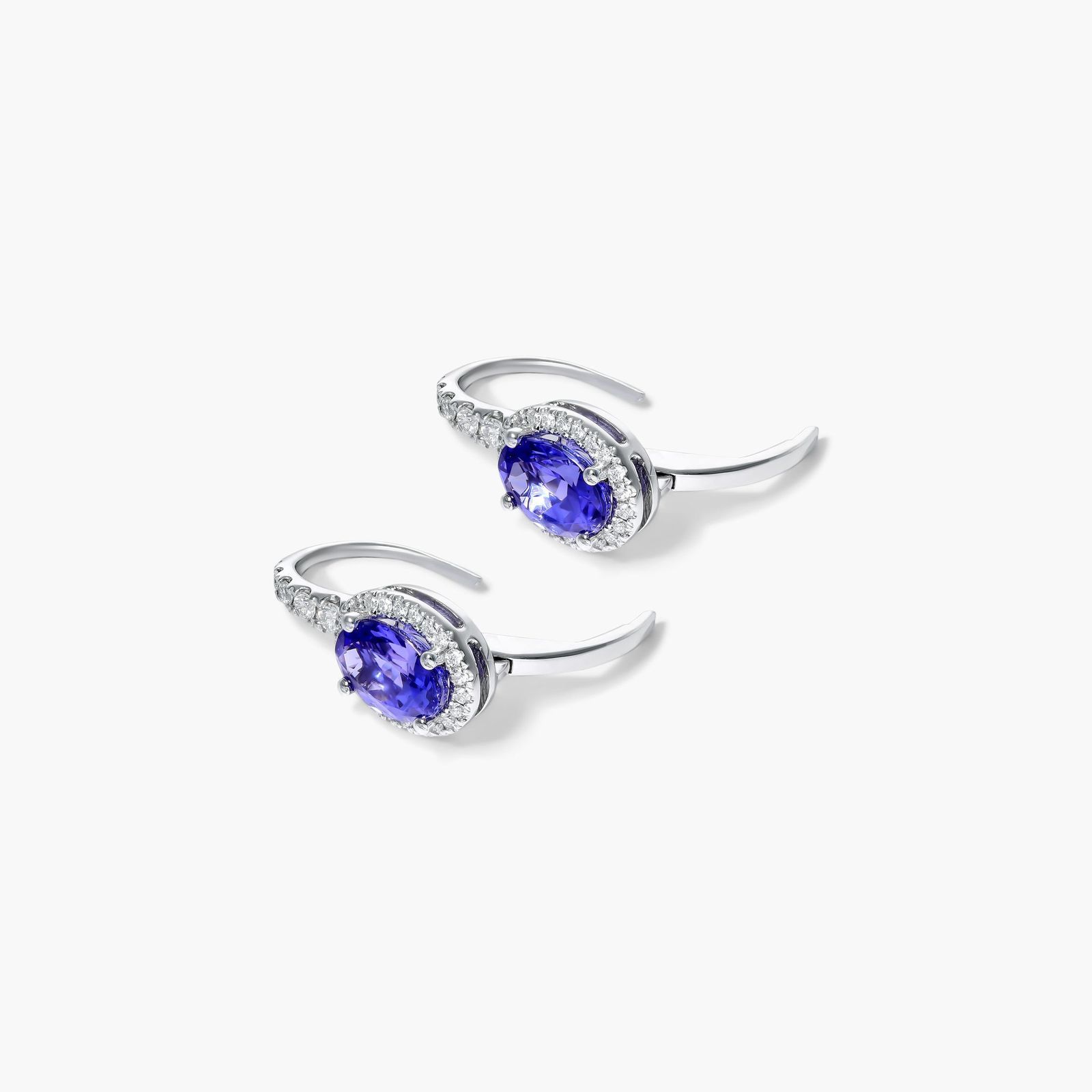 Oval Cut Tanzanite And Diamond Halo Drop Earrings In 14K White Gold
