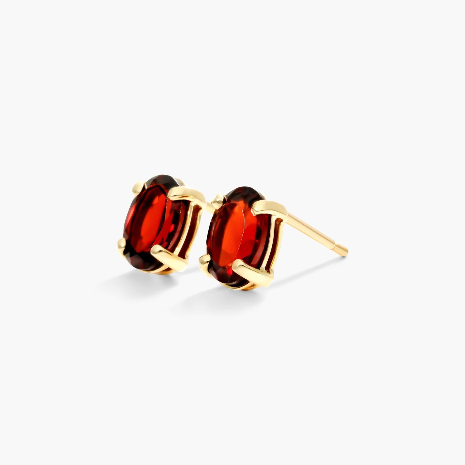 Oval Cut Garnet Birthstone Earrings In 14K Yellow Gold