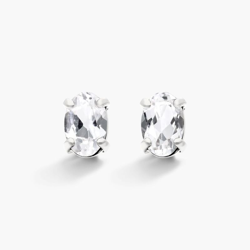 Oval Cut White Topaz Birthstone Earrings In 14K White Gold