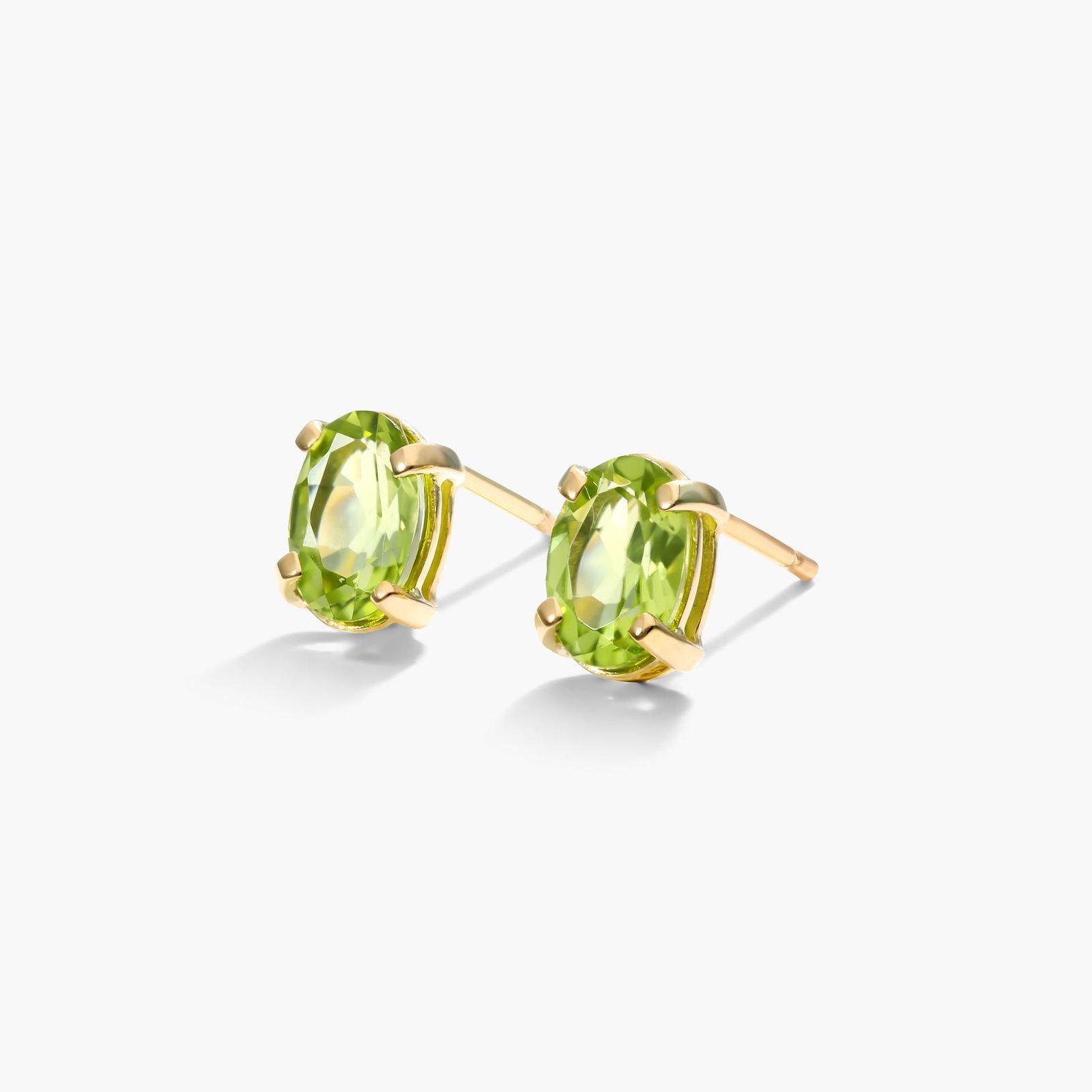Oval Cut Peridot Birthstone Earrings In 14K Yellow Gold