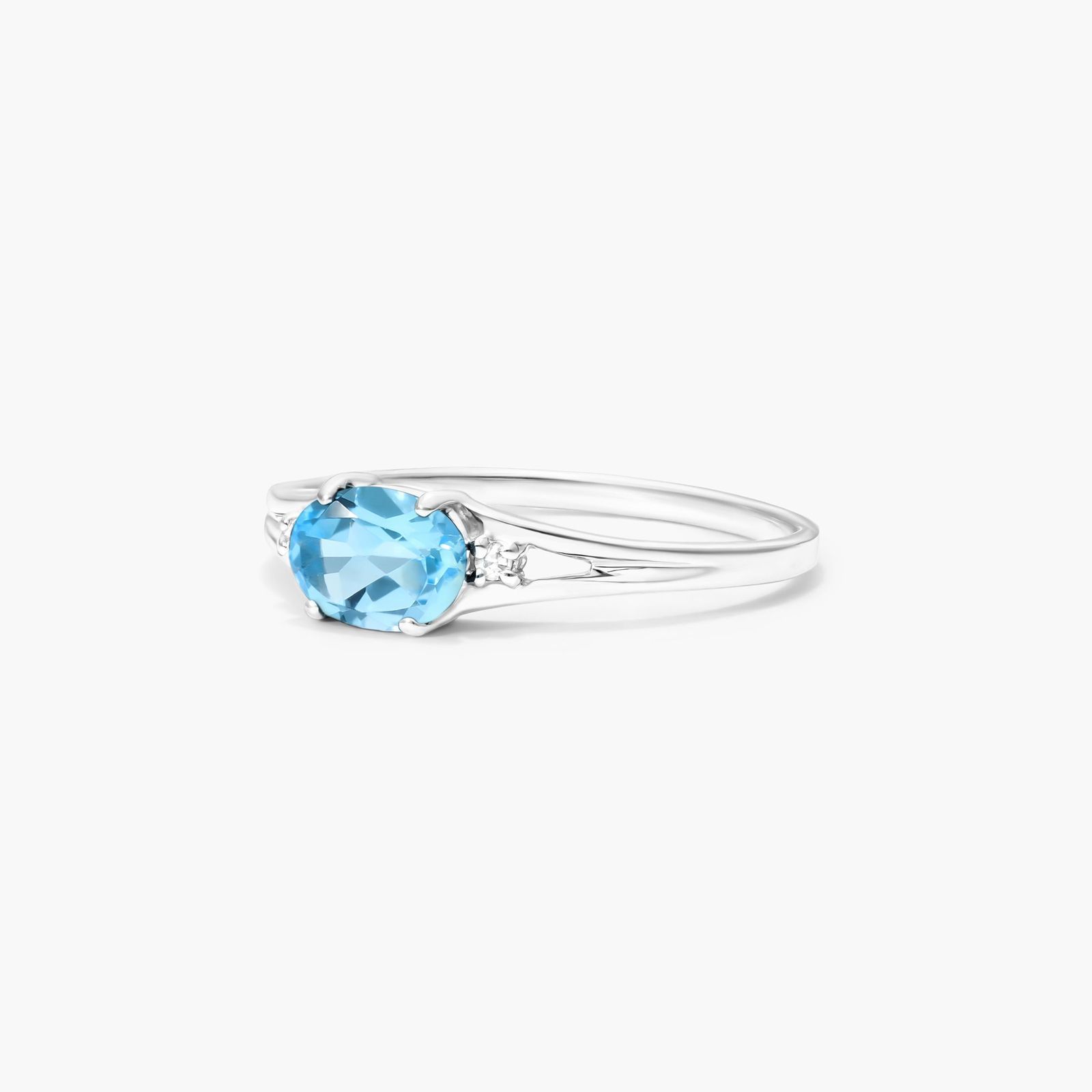 Oval Blue Topaz And Diamond Accent Birthstone Ring In 14K White Gold