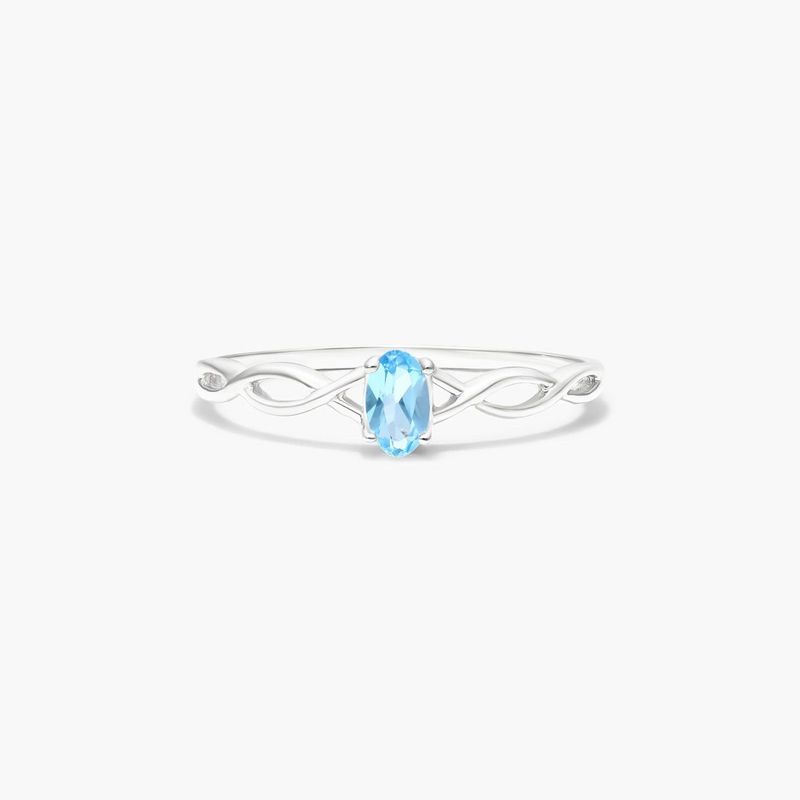 Infinity Blue Topaz Birthstone Ring In 14K White Gold
