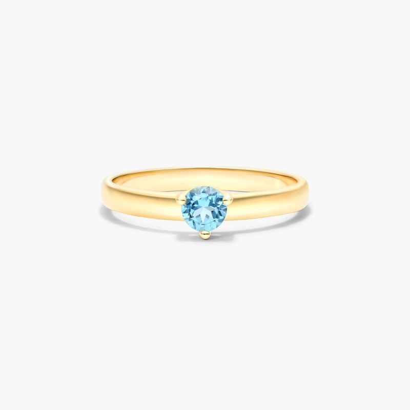 Blue Topaz Solitaire Birthstone Ring In 14K Yellow Gold