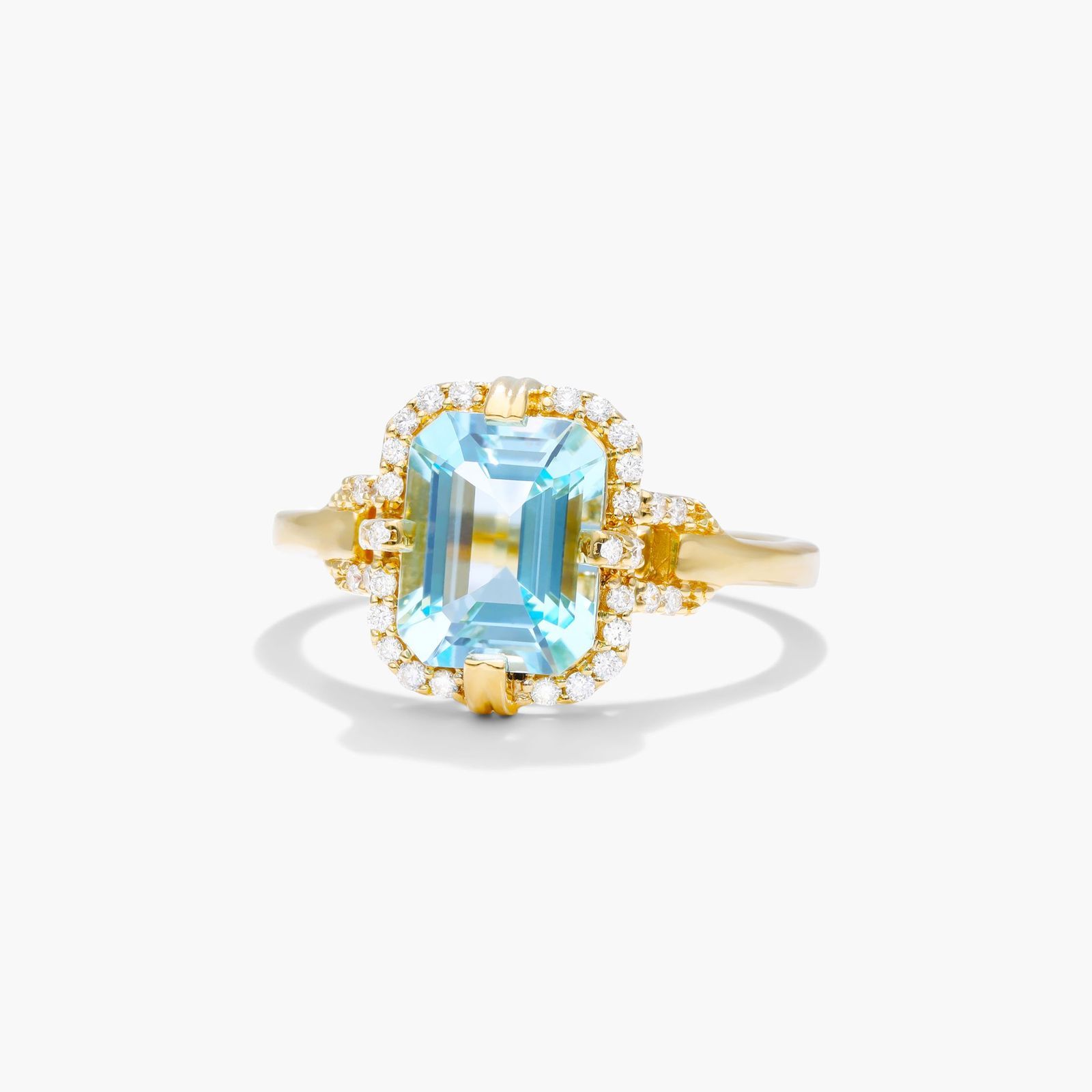Sky Blue Topaz Diamond Halo Ring In 18K Yellow Gold