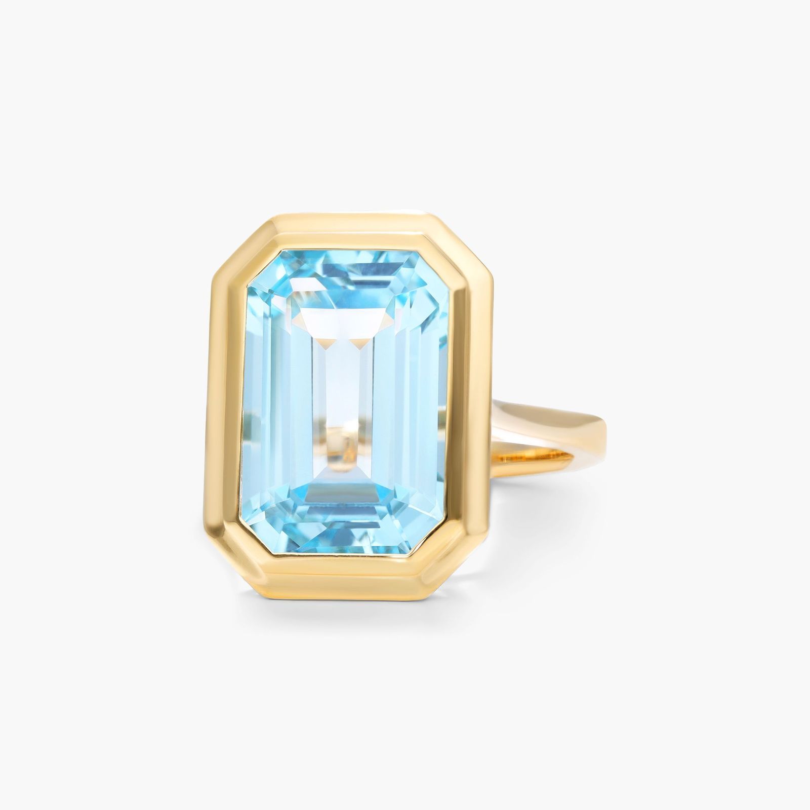 Emerald Cut Bezel Sky Blue Topaz Cocktail Ring In 18K Yellow Gold