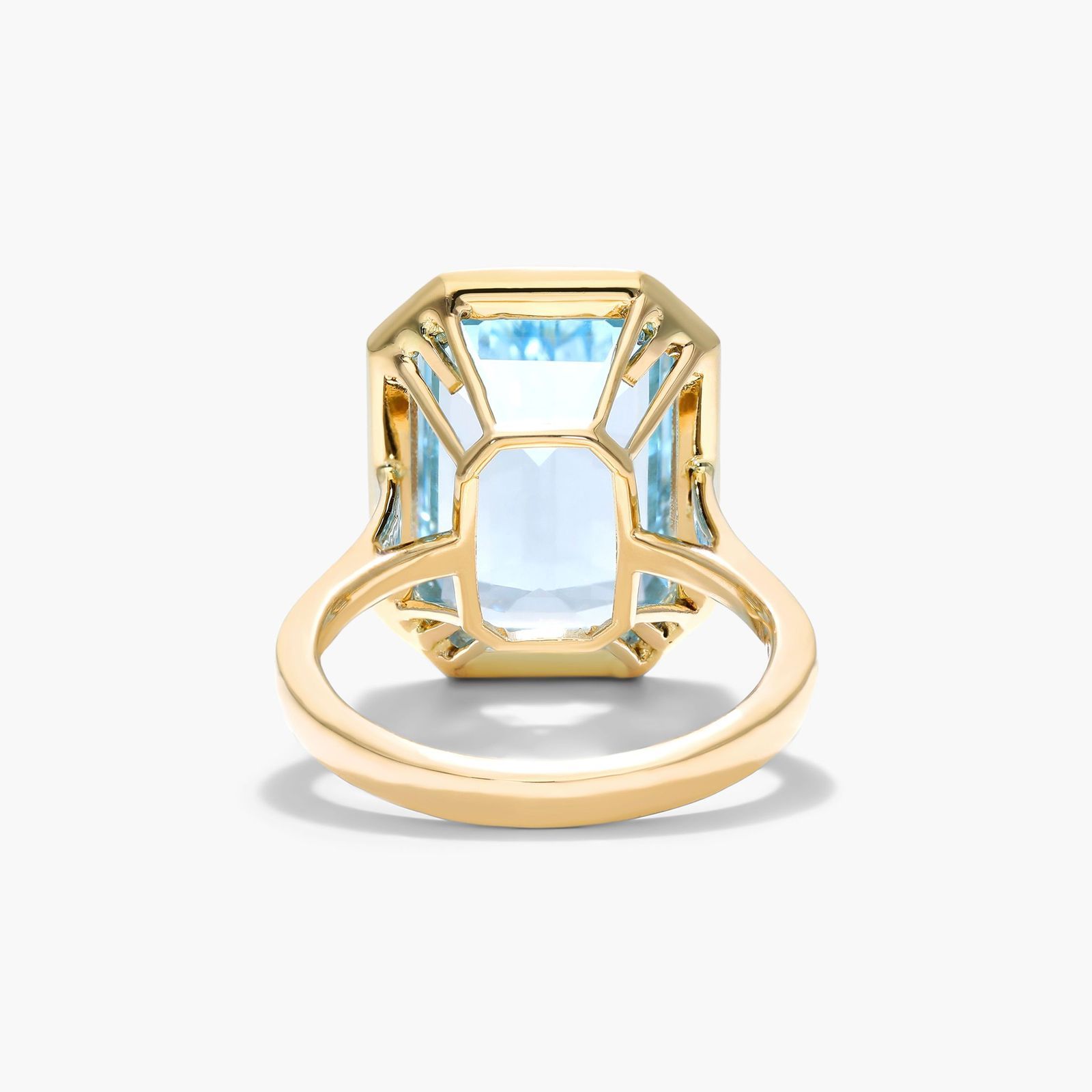Emerald Cut Bezel Sky Blue Topaz Cocktail Ring In 18K Yellow Gold