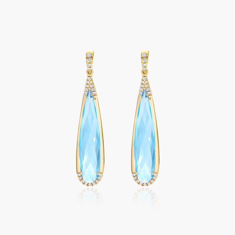 Elongated Pear Shape Blue Topaz Earrings In 14K Yellow Gold