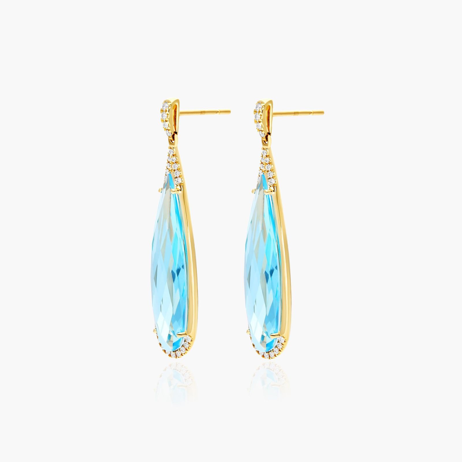Elongated Pear Shape Blue Topaz Earrings In 14K Yellow Gold