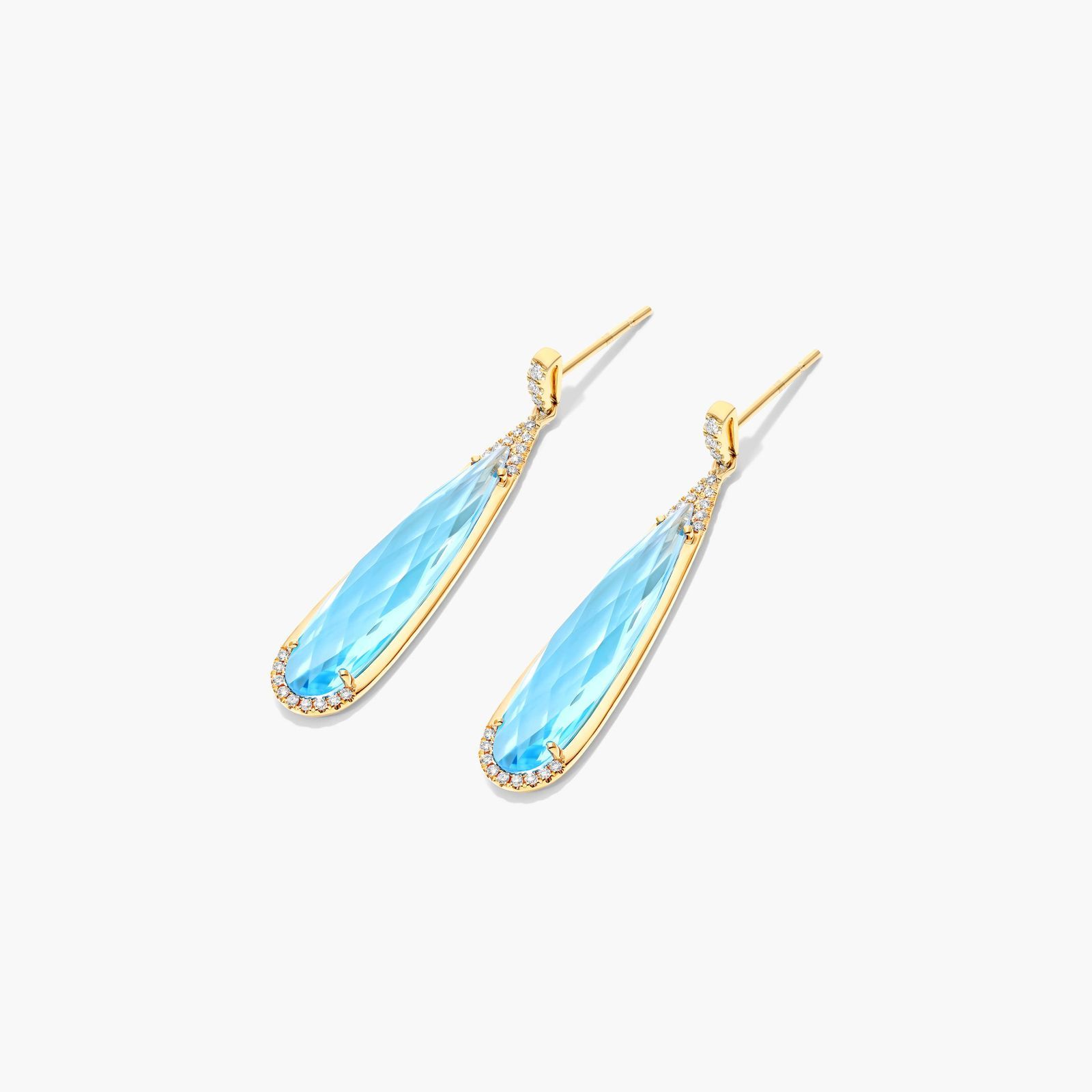 Elongated Pear Shape Blue Topaz Earrings In 14K Yellow Gold