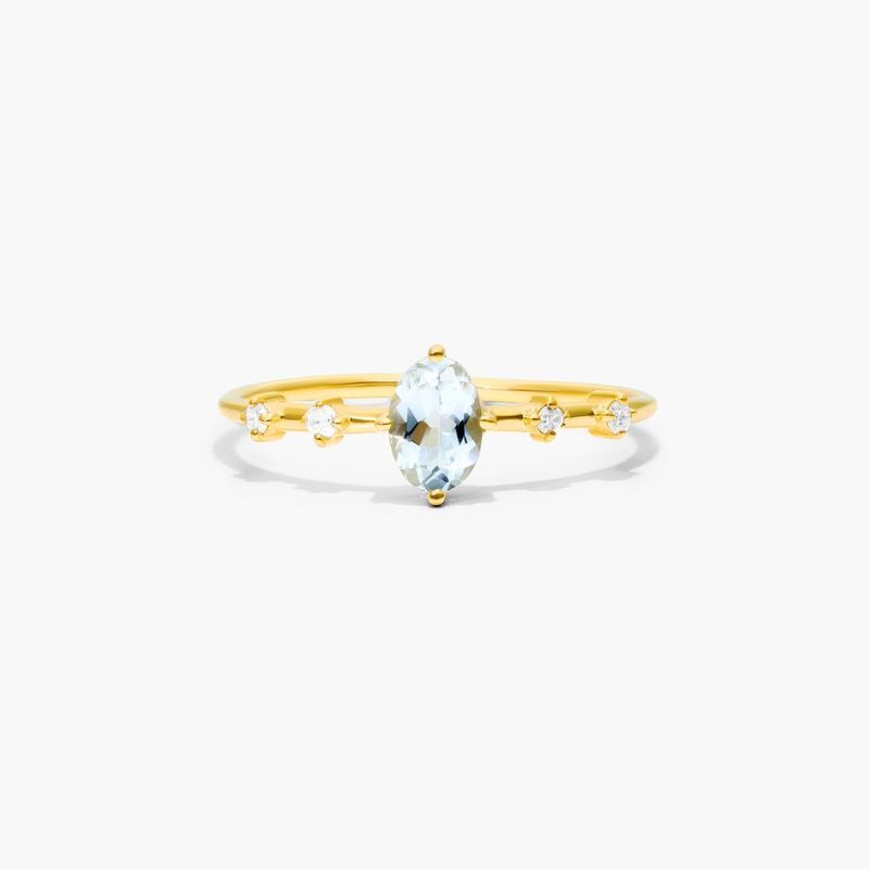 Oval Aquamarine And Diamond Birthstone Ring In 14K Yellow Gold