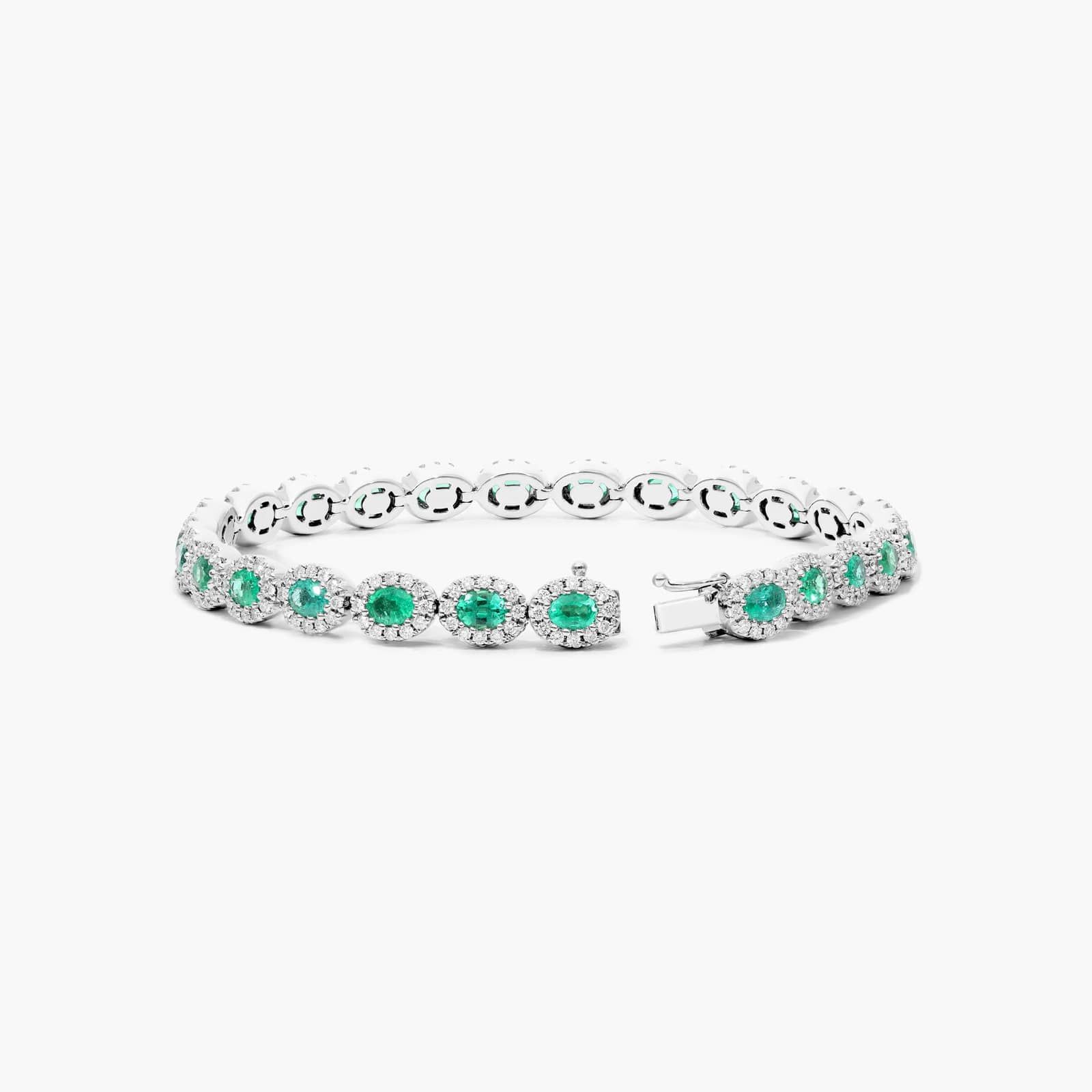 Oval Cut Emerald And Diamond Halo Bracelet In 14K White Gold