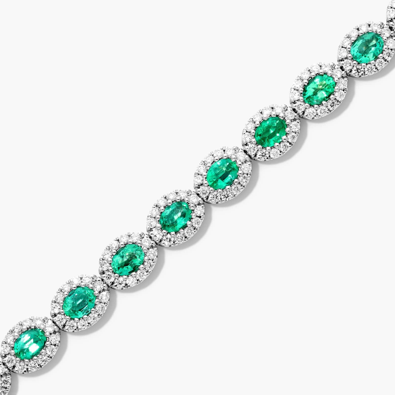 Oval Cut Emerald And Diamond Halo Bracelet In 14K White Gold