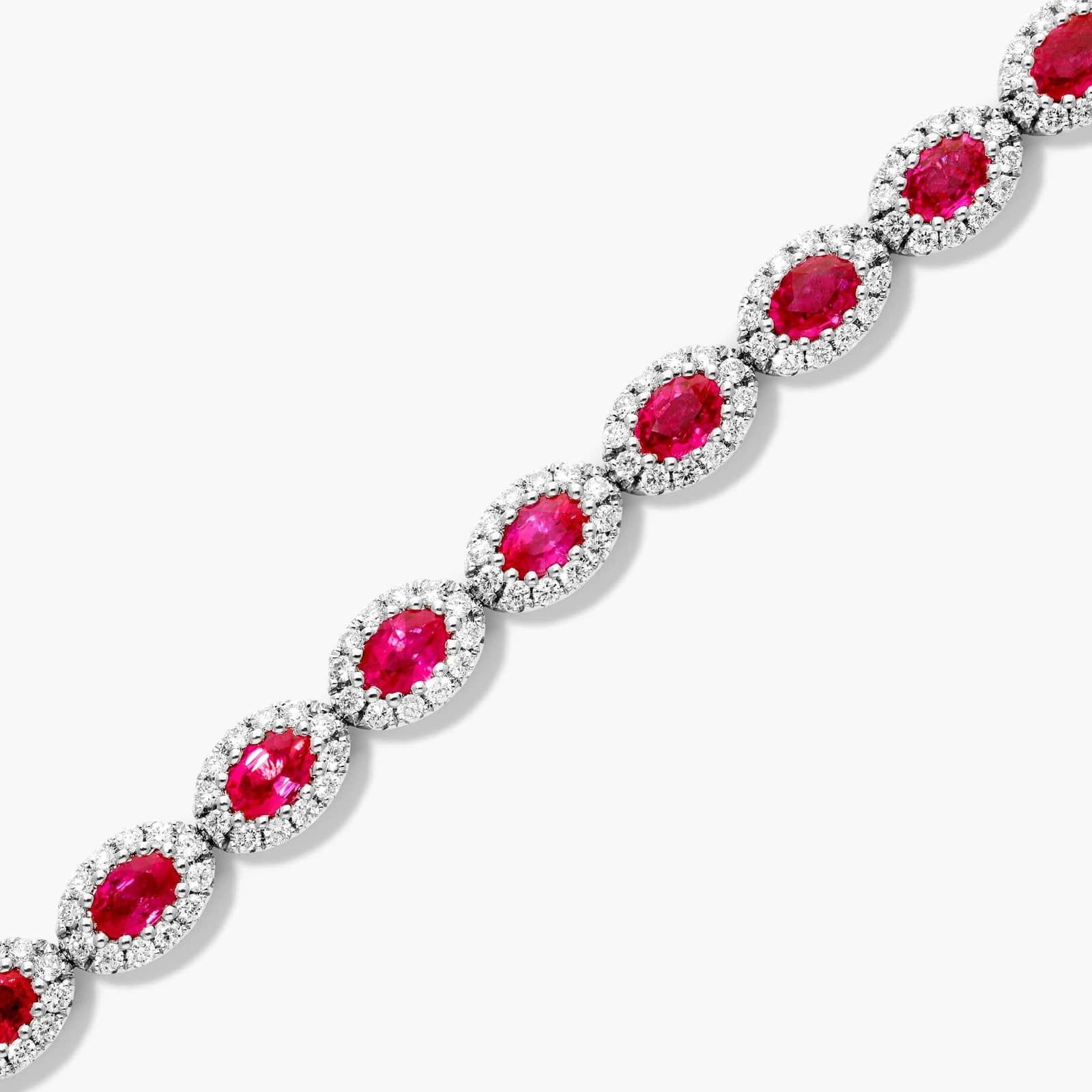 Oval Cut Ruby And Diamond Halo Bracelet In 14K White Gold